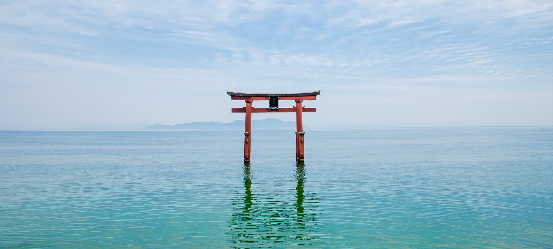 shinto shrine in blue lake in japan